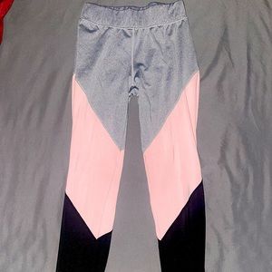 A multi-colored pair of leggings from PINK.